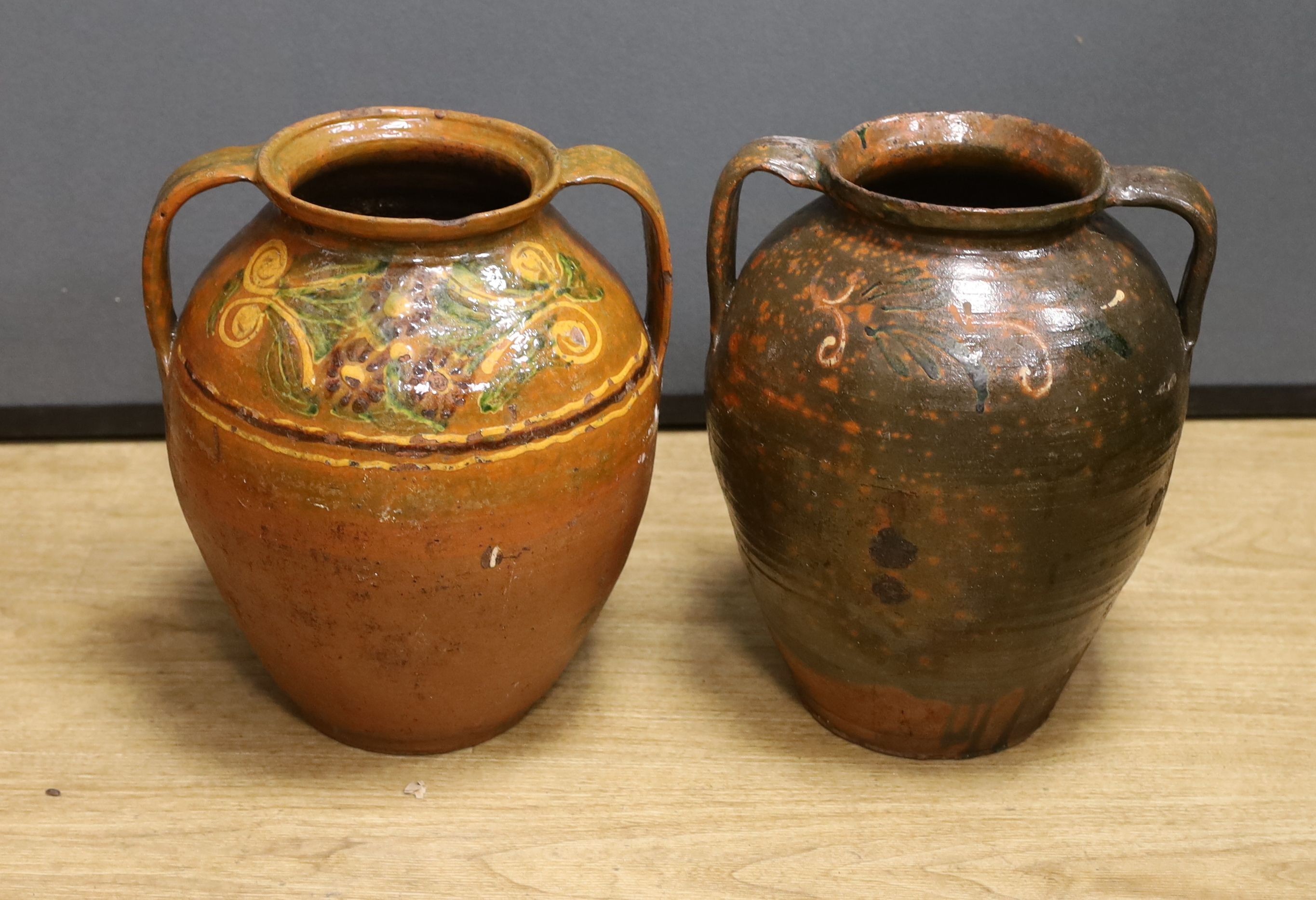 Two 19th century Continental Europe pottery urns - 35cm high